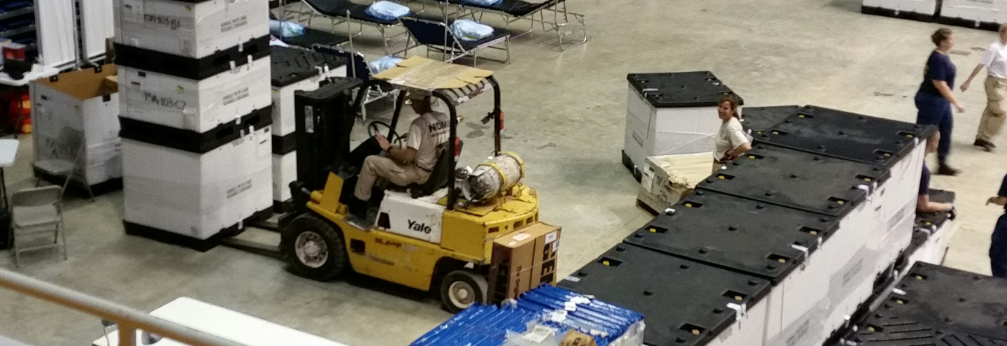 Forklift operating in a warehouse.